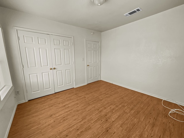 109 S 5th St, Sanger, TX 76266 - unfurnished bedroom with light wood-style flooring, baseboards, and a closet