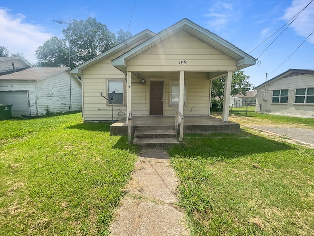 109 S 5th St, Sanger, TX 76266 - view of front of property featuring covered porch and a front yard