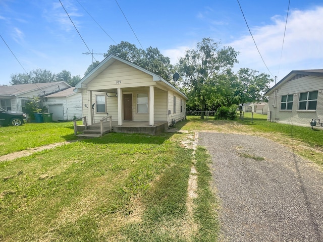 109 S 5th St, Sanger, TX 76266 - shotgun-style home with covered porch and driveway