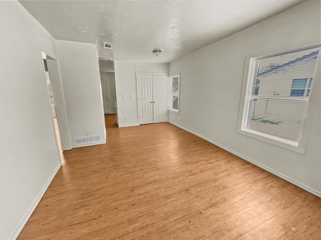 109 S 5th St, Sanger, TX 76266 - unfurnished bedroom featuring light wood-style floors, baseboards, and a closet