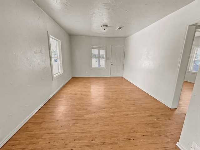 109 S 5th St, Sanger, TX 76266 - empty room with light wood-style floors and baseboards