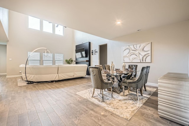 1225 Elmwood Dr, Cedar Hill, TX 75104 - dining room with baseboards, wood finished floors, and a towering ceiling