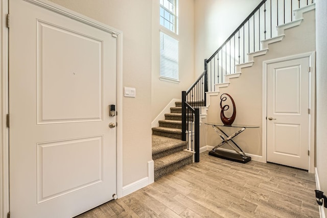 1225 Elmwood Dr, Cedar Hill, TX 75104 - foyer entrance featuring wood finished floors, stairway, and baseboards