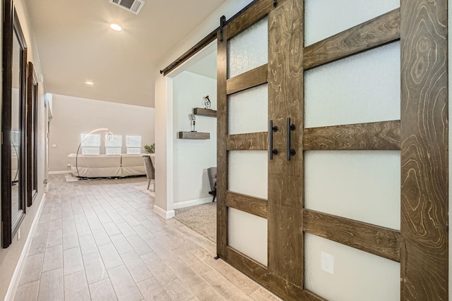 1225 Elmwood Dr, Cedar Hill, TX 75104 - corridor featuring a barn door, baseboards, recessed lighting, and wood finished floors