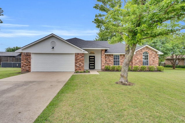 307 Pebble Creek Ln, Red Oak, TX 75154 - view of front of property featuring an attached garage, brick siding, and a front lawn