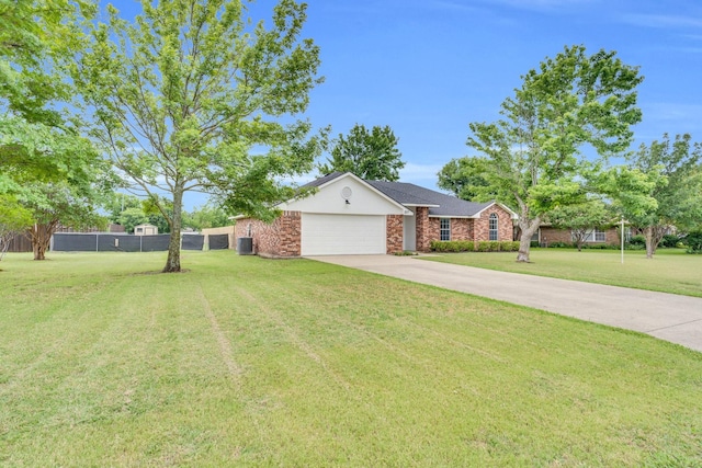 307 Pebble Creek Ln, Red Oak, TX 75154 - view of front of house featuring an attached garage, concrete driveway, cooling unit, and brick siding