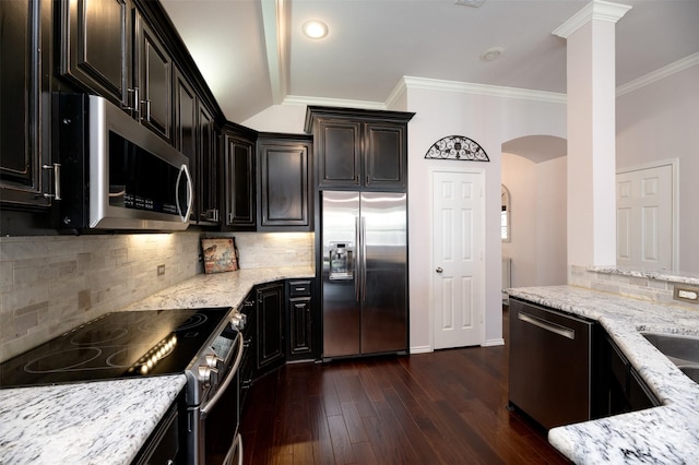 5141 Pinellas Ave, Fort Worth, TX 76244 - kitchen with appliances with stainless steel finishes, light stone countertops, dark wood-style floors, decorative backsplash, and ornamental molding