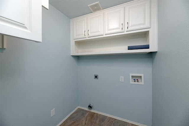 5141 Pinellas Ave, Fort Worth, TX 76244 - laundry room with hookup for an electric dryer, hookup for a washing machine, cabinet space, dark wood-type flooring, and baseboards