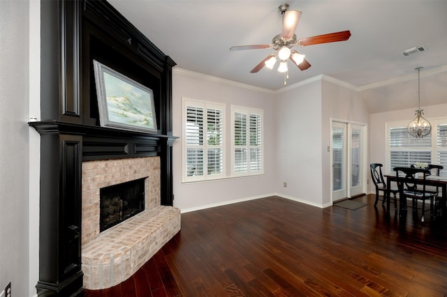 5141 Pinellas Ave, Fort Worth, TX 76244 - living room with dark wood-type flooring, a chandelier, ceiling fan, a brick fireplace, and crown molding