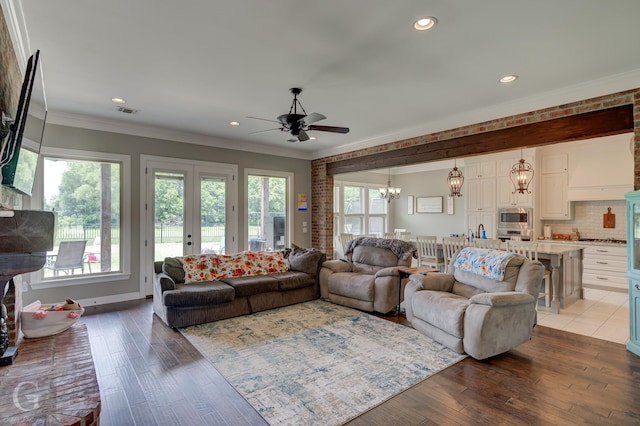 1029 Spanish Moss Cir, Bossier City, LA 71111 - living area featuring a ceiling fan, a chandelier, recessed lighting, wood finished floors, and crown molding