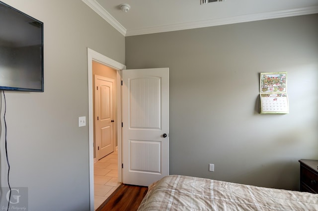 1029 Spanish Moss Cir, Bossier City, LA 71111 - bedroom with ornamental molding and dark wood-style floors