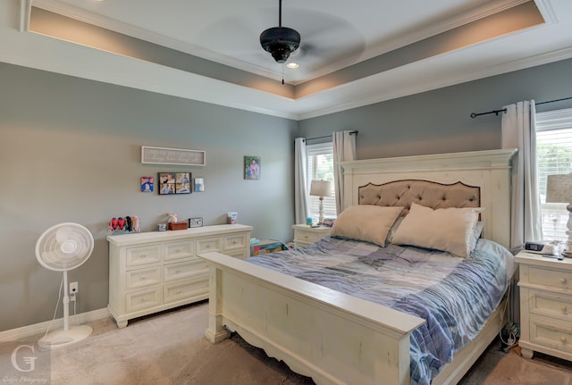 1029 Spanish Moss Cir, Bossier City, LA 71111 - bedroom featuring light colored carpet, ornamental molding, a tray ceiling, ceiling fan, and baseboards