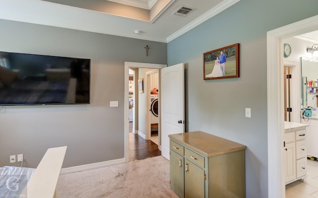 1029 Spanish Moss Cir, Bossier City, LA 71111 - hallway with crown molding, washer / dryer, baseboards, and light colored carpet