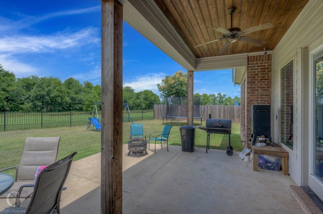 1029 Spanish Moss Cir, Bossier City, LA 71111 - view of patio featuring a trampoline, a ceiling fan, a playground, and area for grilling
