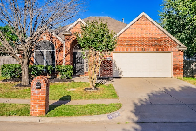 7028 Herman Jared Dr, North Richland Hills, TX 76182 - traditional-style house with brick siding, concrete driveway, and a garage