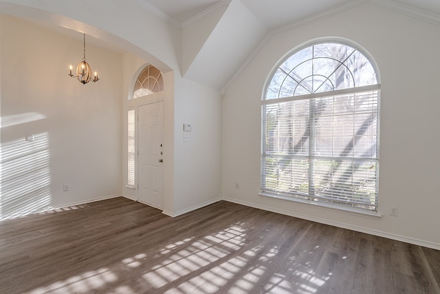 7028 Herman Jared Dr, North Richland Hills, TX 76182 - foyer featuring plenty of natural light, a chandelier, lofted ceiling, wood finished floors, and baseboards