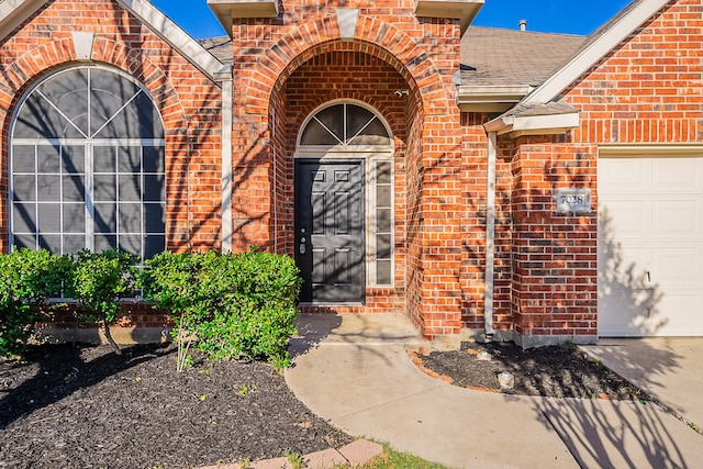 7028 Herman Jared Dr, North Richland Hills, TX 76182 - entrance to property featuring brick siding and an attached garage