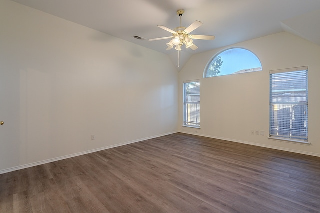 7028 Herman Jared Dr, North Richland Hills, TX 76182 - spare room featuring lofted ceiling, dark wood-style flooring, ceiling fan, and baseboards