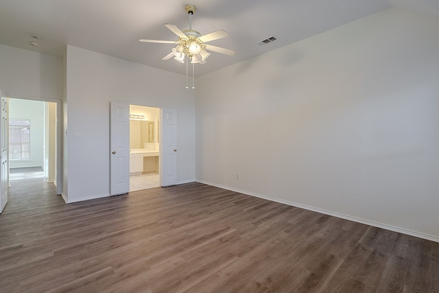 7028 Herman Jared Dr, North Richland Hills, TX 76182 - spare room with wood finished floors, a ceiling fan, baseboards, and vaulted ceiling