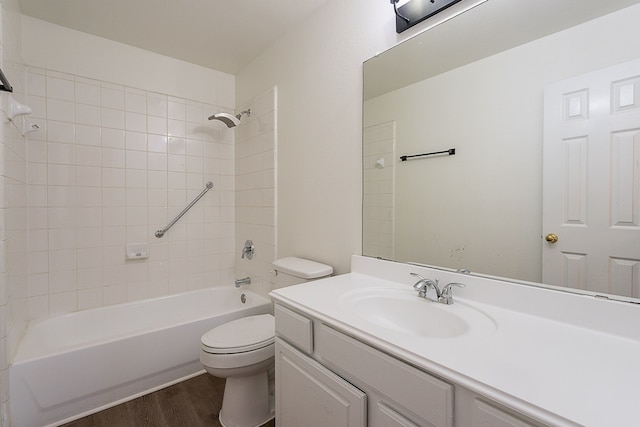 7028 Herman Jared Dr, North Richland Hills, TX 76182 - bathroom with wood finished floors, toilet, vanity, and washtub / shower combination