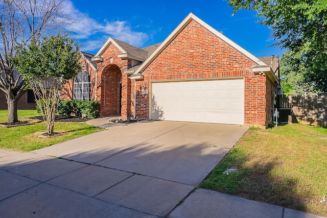 7028 Herman Jared Dr, North Richland Hills, TX 76182 - traditional-style home with brick siding, a garage, and concrete driveway