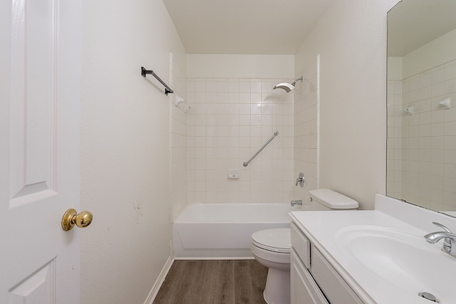 7028 Herman Jared Dr, North Richland Hills, TX 76182 - bathroom with wood finished floors, toilet, vanity, washtub / shower combination, and baseboards