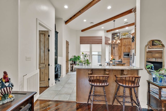129 Carondelet Ct, Bossier City, LA 71111 - kitchen featuring beam ceiling, recessed lighting, a peninsula, stainless steel appliances, and a chandelier