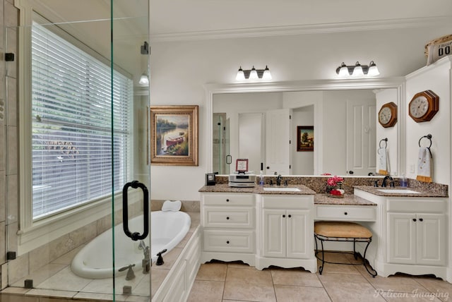 129 Carondelet Ct, Bossier City, LA 71111 - full bath with double vanity, ornamental molding, a bath, a stall shower, and tile patterned floors