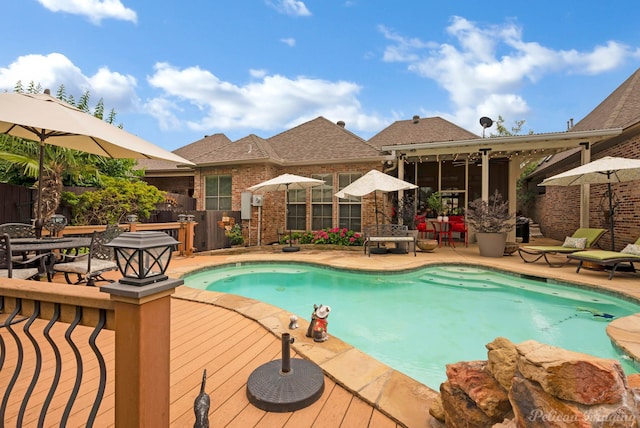129 Carondelet Ct, Bossier City, LA 71111 - view of swimming pool featuring a wooden deck, outdoor dining area, and a patio area