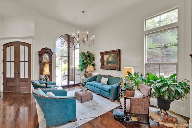 129 Carondelet Ct, Bossier City, LA 71111 - living area with a chandelier, healthy amount of natural light, dark wood-style flooring, and crown molding