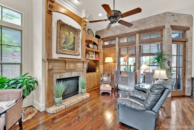 129 Carondelet Ct, Bossier City, LA 71111 - living area with a ceiling fan, hardwood / wood-style flooring, a brick fireplace, and recessed lighting