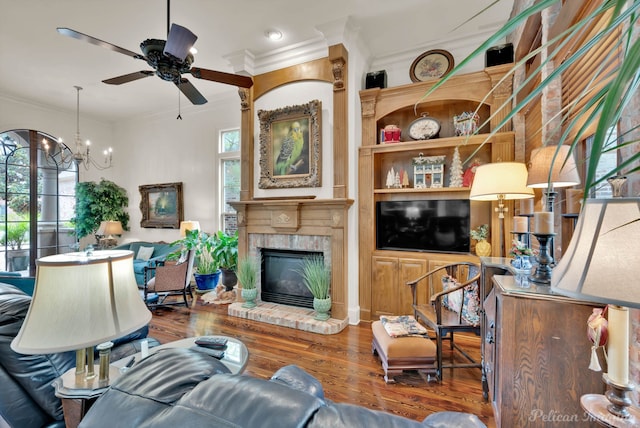 129 Carondelet Ct, Bossier City, LA 71111 - living area with crown molding, plenty of natural light, a ceiling fan, wood finished floors, and a chandelier