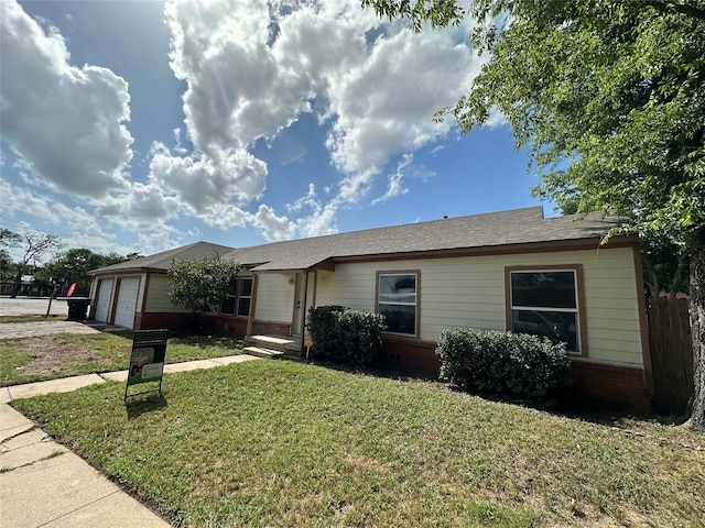 107 Mcarthur Ln, Cleburne, TX 76031 - single story home featuring a garage, a front lawn, brick siding, and concrete driveway