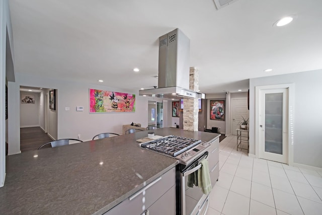 3116 Sharpview Ln, Dallas, TX 75228 - kitchen featuring gas range, island range hood, light tile patterned flooring, decorative columns, and recessed lighting