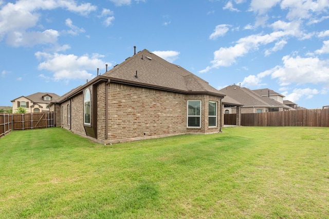 302 Micco Ln, Rockwall, TX 75087 - rear view of property with brick siding and a shingled roof