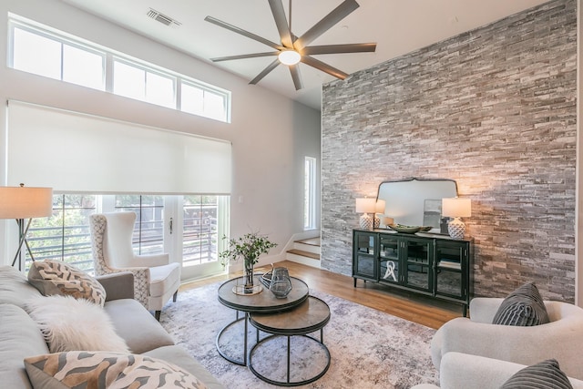 3200 Ross Ave Unit 6, Dallas, TX 75204 - living room featuring wood finished floors, ceiling fan, and a high ceiling