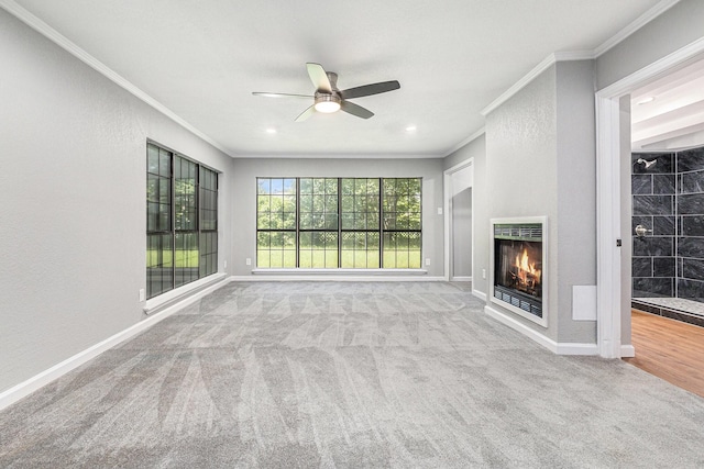 6412 Regal Rd, Forest Hill, TX 76119 - unfurnished living room with ornamental molding, carpet, a ceiling fan, heating unit, and a warm lit fireplace