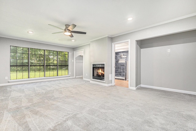 6412 Regal Rd, Forest Hill, TX 76119 - unfurnished living room featuring ornamental molding, ceiling fan, carpet floors, recessed lighting, and a multi sided fireplace