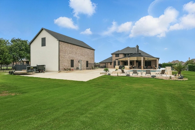 1330 Billingsley Dr, Waxahachie, TX 75167 - back of house with a patio area, an outdoor pool, brick siding, and a lawn