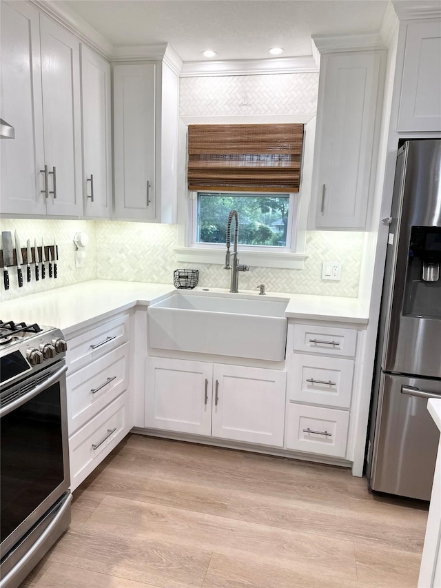 107 S Lakeview Dr, Lacy Lakeview, TX 76705 - kitchen featuring appliances with stainless steel finishes, a sink, white cabinets, and light countertops