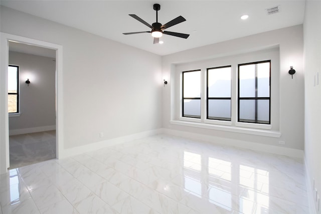 10787 Leake Ln, Frisco, TX 75035 - unfurnished room with baseboards, ceiling fan, marble finish floors, and recessed lighting