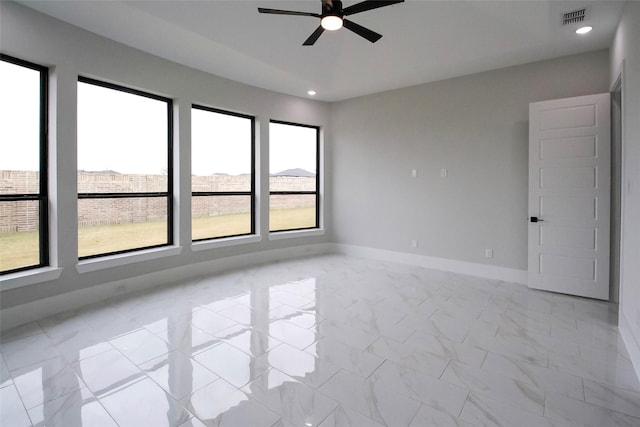 10787 Leake Ln, Frisco, TX 75035 - empty room with ceiling fan, light marble finish flooring, baseboards, and recessed lighting
