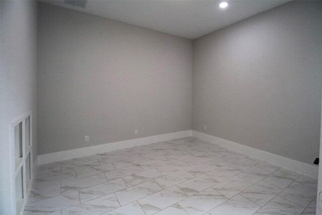 10787 Leake Ln, Frisco, TX 75035 - unfurnished room featuring light marble finish floors, recessed lighting, and baseboards
