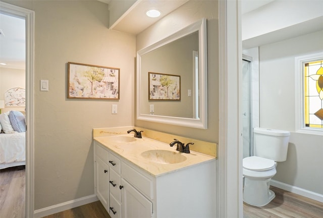 7208 Maranatha Ct, Colleyville, TX 76034 - bathroom with wood finished floors, ensuite bathroom, baseboards, and double vanity