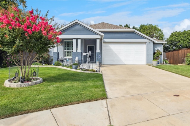 901 Freesia Dr, Little Elm, TX 75068 - view of front of property featuring an attached garage, driveway, brick siding, and covered porch