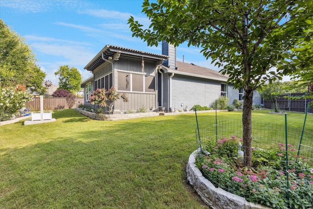 901 Freesia Dr, Little Elm, TX 75068 - rear view of house with a chimney and brick siding