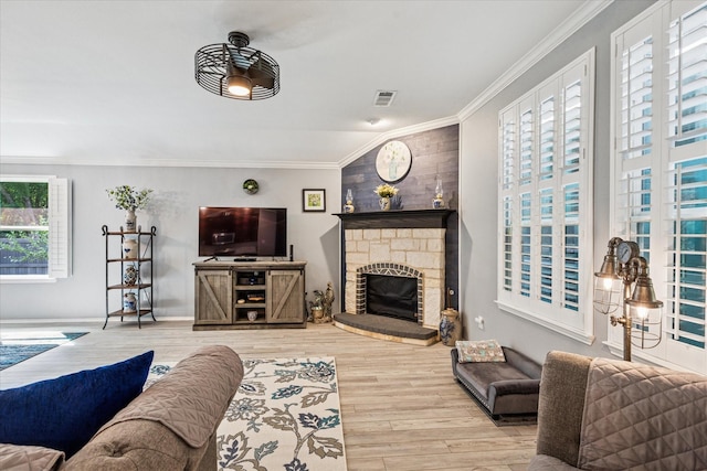 901 Freesia Dr, Little Elm, TX 75068 - living room with ornamental molding, wood finished floors, a fireplace, and baseboards