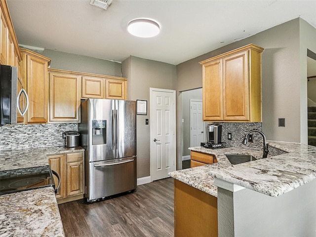 157 Castleridge Dr Unit B, Little Elm, TX 75068 - kitchen featuring stainless steel appliances, tasteful backsplash, light stone countertops, dark wood-type flooring, and a sink