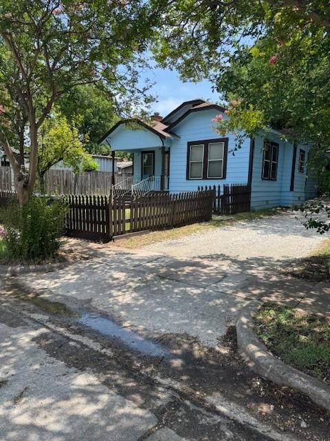 1806 Live Oak Ave, Waco, TX 76708 - view of front of property featuring a fenced front yard and driveway