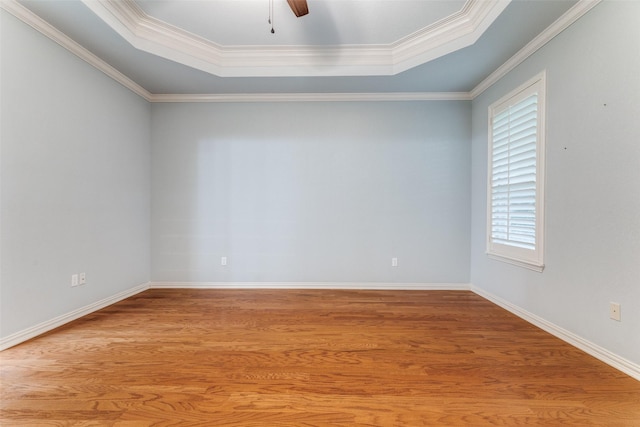 805 Evergreen Ct, Keller, TX 76248 - empty room featuring a tray ceiling, wood finished floors, ceiling fan, crown molding, and baseboards